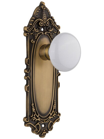 Largo Design Door Set With White Porcelain Door Knobs Single Dummy in Antique Brass.
